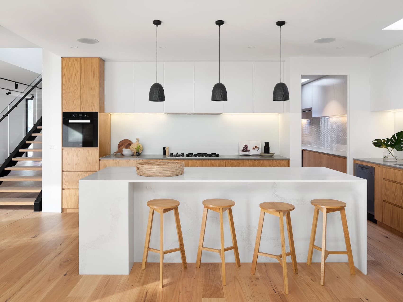 Intelligent modular kitchen with sleek countertops and automated task lighting zones